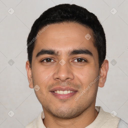 Joyful latino young-adult male with short  black hair and brown eyes