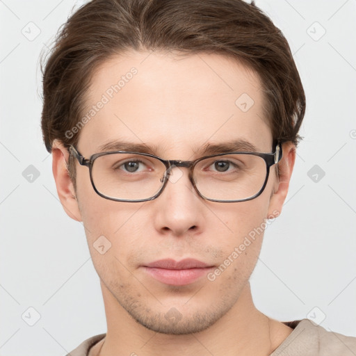 Neutral white young-adult male with short  brown hair and grey eyes