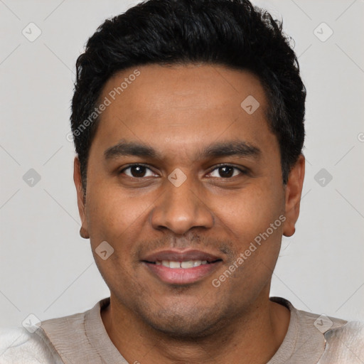 Joyful latino young-adult male with short  black hair and brown eyes