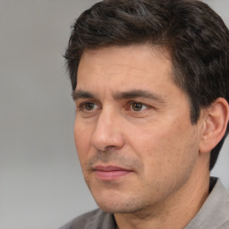 Neutral white adult male with short  black hair and brown eyes