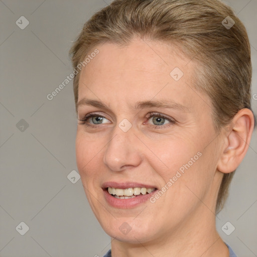 Joyful white adult female with short  brown hair and brown eyes