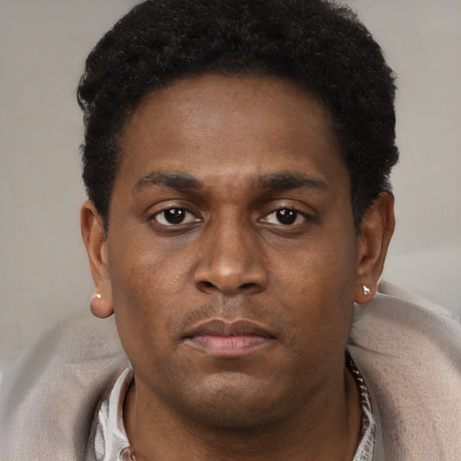 Neutral black young-adult male with short  brown hair and brown eyes