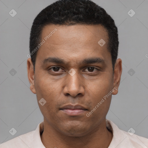 Neutral latino young-adult male with short  black hair and brown eyes
