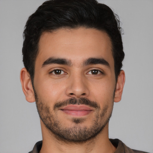 Neutral latino young-adult male with short  brown hair and brown eyes
