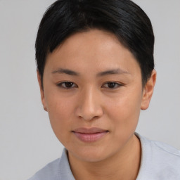 Joyful asian young-adult female with short  black hair and brown eyes