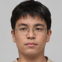 Neutral asian young-adult male with short  brown hair and brown eyes