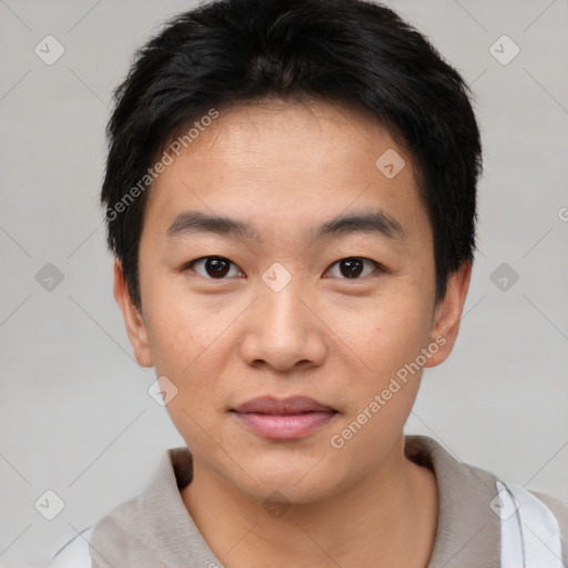 Joyful asian young-adult male with short  black hair and brown eyes