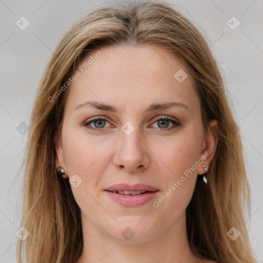 Joyful white young-adult female with long  brown hair and green eyes