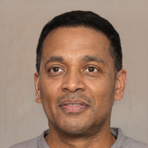Neutral latino adult male with short  black hair and brown eyes