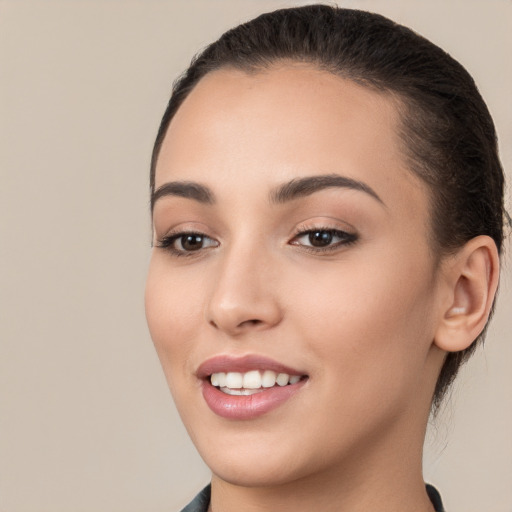 Joyful white young-adult female with long  brown hair and brown eyes