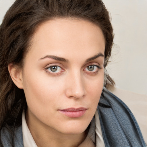 Neutral white young-adult female with long  brown hair and blue eyes