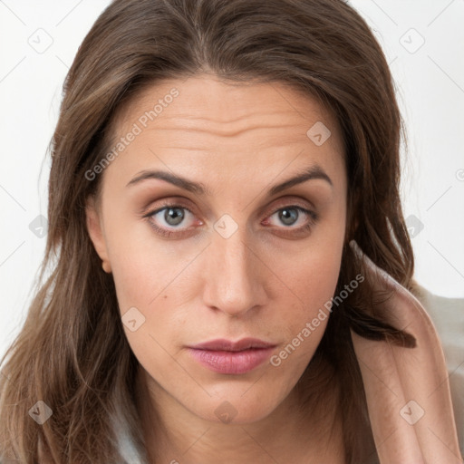 Neutral white young-adult female with long  brown hair and brown eyes