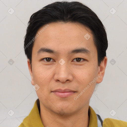 Joyful asian young-adult male with short  brown hair and brown eyes