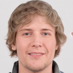 Joyful white adult male with short  brown hair and grey eyes