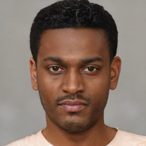 Neutral black young-adult male with short  black hair and brown eyes
