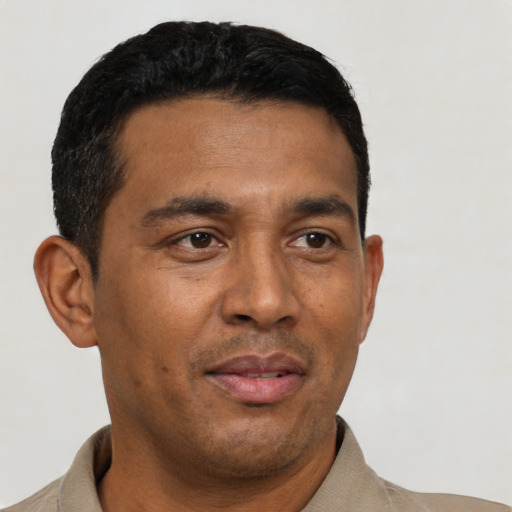 Neutral latino adult male with short  black hair and brown eyes