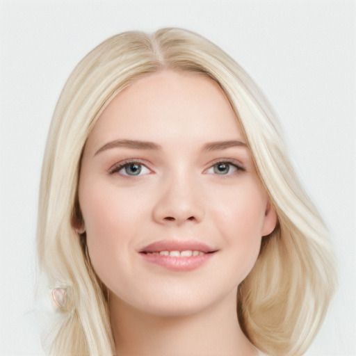 Joyful white young-adult female with long  brown hair and blue eyes