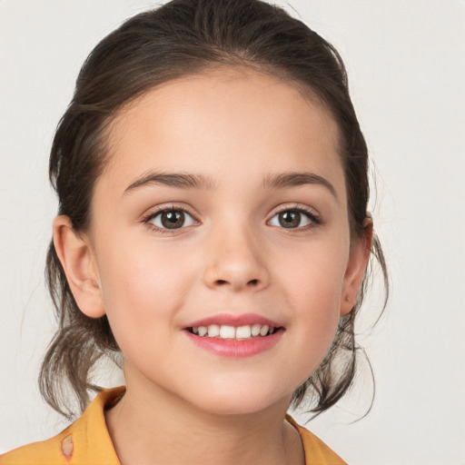 Joyful white child female with medium  brown hair and brown eyes