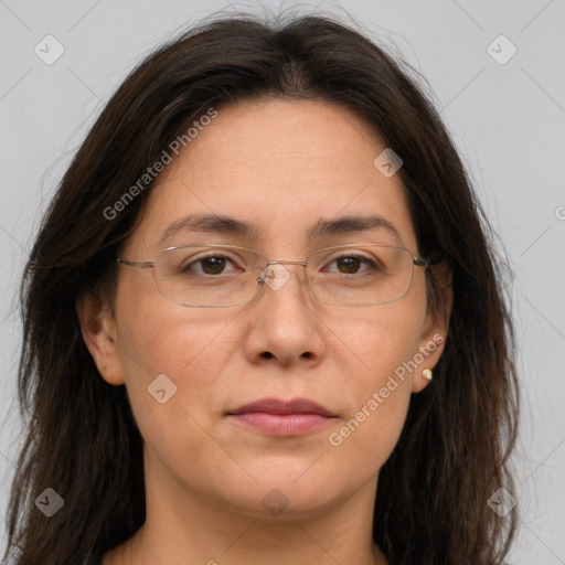 Joyful white adult female with long  brown hair and brown eyes