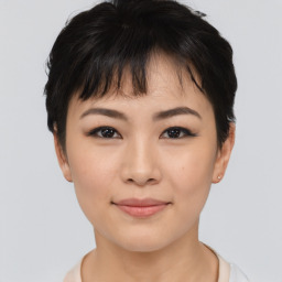 Joyful asian young-adult female with short  black hair and brown eyes