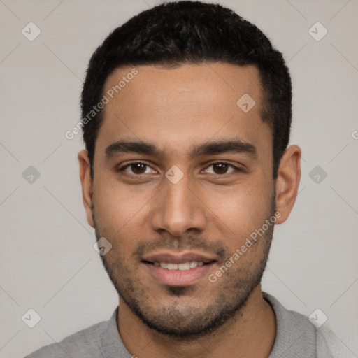 Joyful white young-adult male with short  black hair and brown eyes