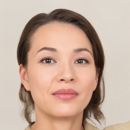 Joyful white young-adult female with medium  brown hair and brown eyes