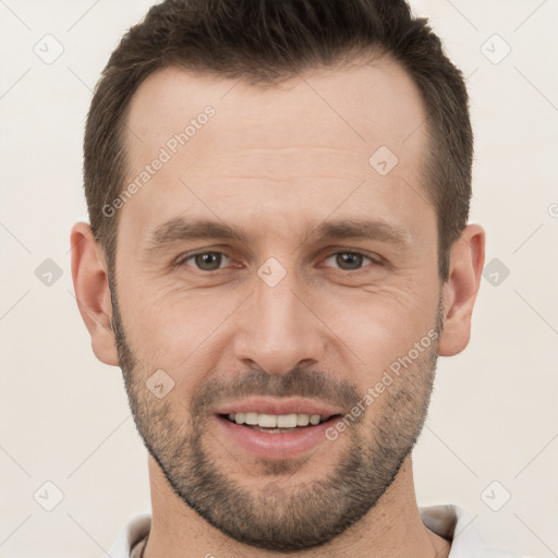 Joyful white young-adult male with short  brown hair and brown eyes