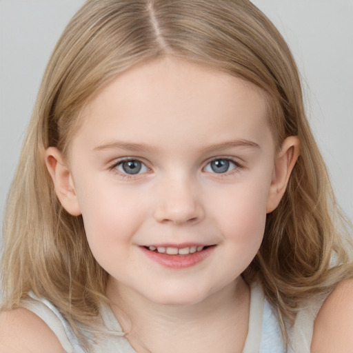 Joyful white child female with medium  brown hair and grey eyes