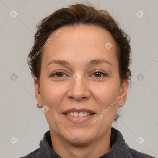 Joyful white adult female with short  brown hair and brown eyes