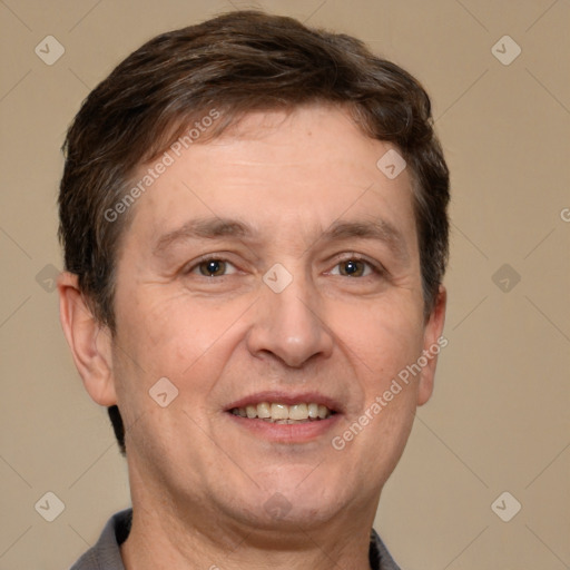 Joyful white adult male with short  brown hair and brown eyes