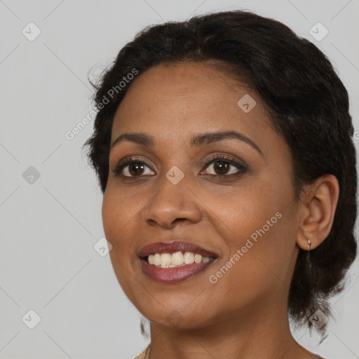 Joyful black young-adult female with medium  brown hair and brown eyes