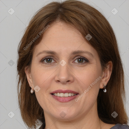 Joyful white adult female with medium  brown hair and grey eyes