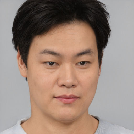Neutral asian young-adult male with short  brown hair and brown eyes