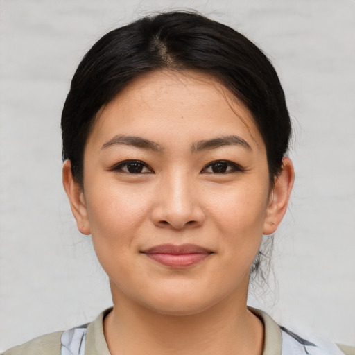 Joyful white young-adult female with medium  brown hair and brown eyes