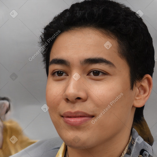 Joyful latino young-adult male with short  black hair and brown eyes