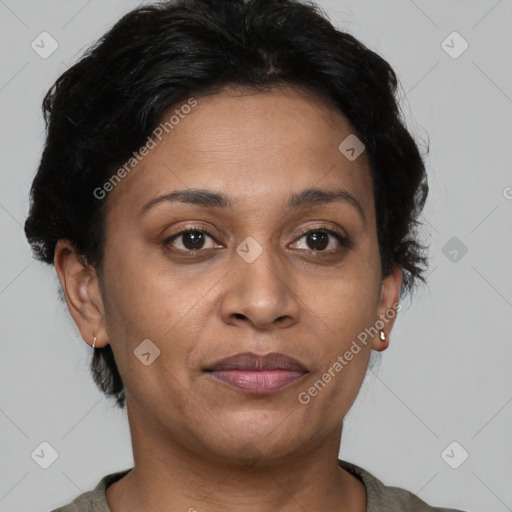 Joyful latino adult female with short  brown hair and brown eyes