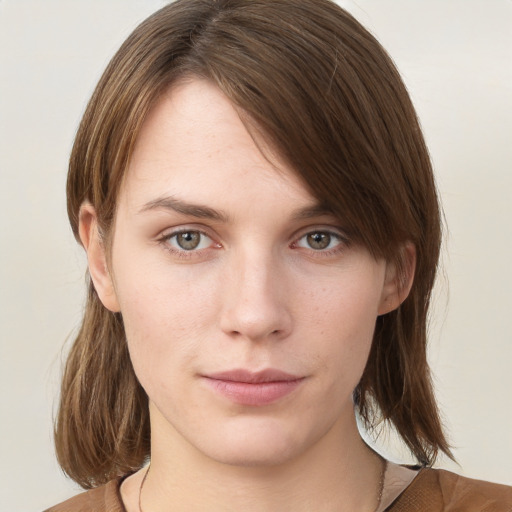 Neutral white young-adult female with medium  brown hair and grey eyes