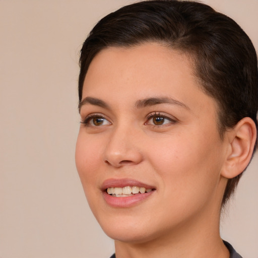 Joyful white young-adult female with short  brown hair and brown eyes