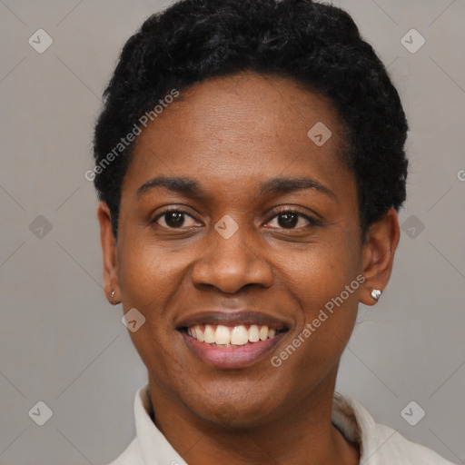 Joyful black young-adult female with short  black hair and brown eyes