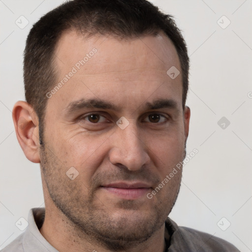 Joyful white adult male with short  brown hair and brown eyes