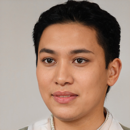 Joyful latino young-adult female with short  black hair and brown eyes