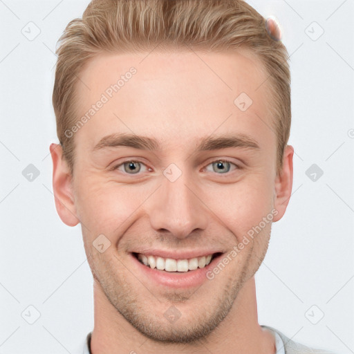 Joyful white young-adult male with short  brown hair and grey eyes