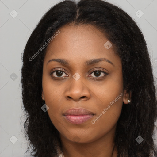 Joyful black young-adult female with long  brown hair and brown eyes