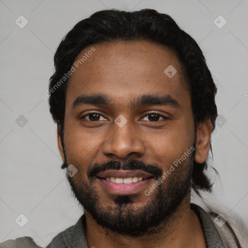 Joyful black young-adult male with short  black hair and brown eyes