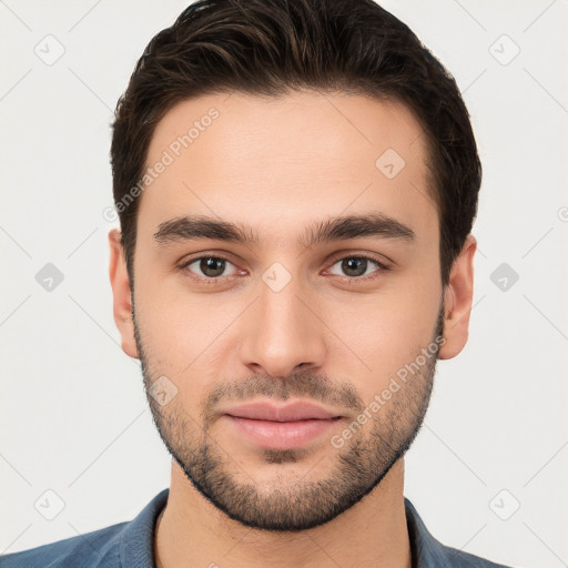 Neutral white young-adult male with short  brown hair and brown eyes