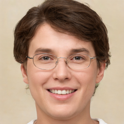 Joyful white adult male with short  brown hair and green eyes