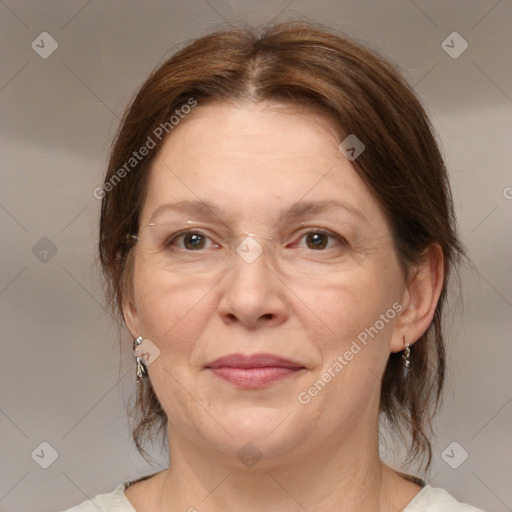 Joyful white adult female with medium  brown hair and grey eyes