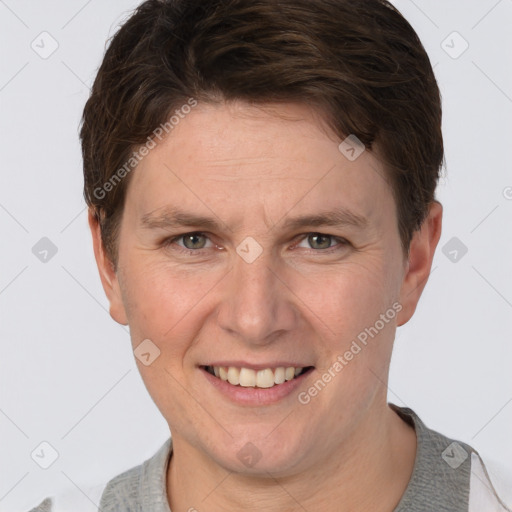 Joyful white adult male with short  brown hair and grey eyes