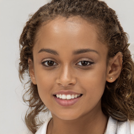 Joyful white child female with long  brown hair and brown eyes