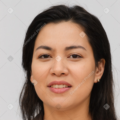 Joyful asian young-adult female with long  brown hair and brown eyes